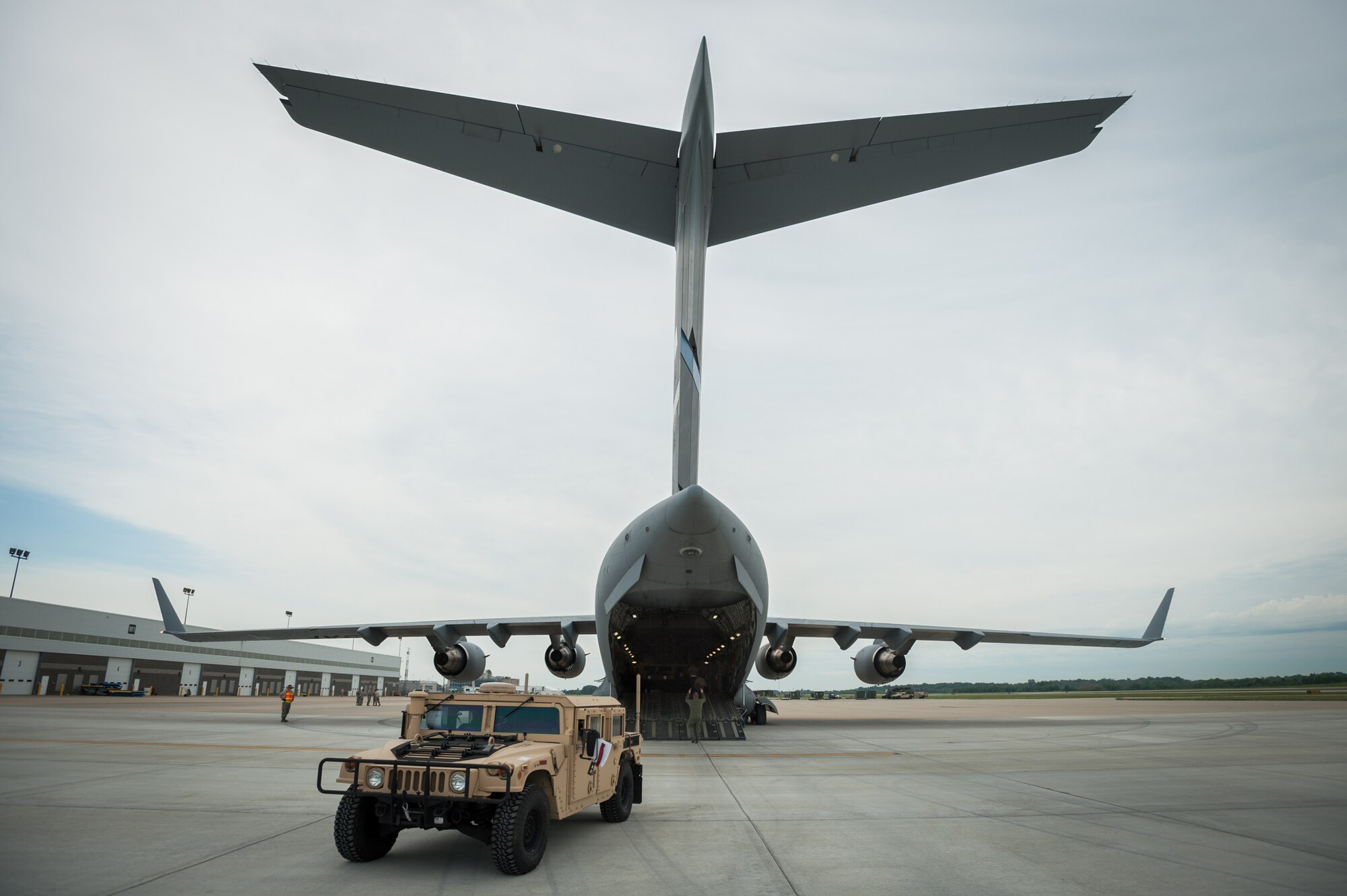 Members of the Kentucky Air National Guard’s 123rd Contingency Response Group offload a Humvee from a Mississippi Air National Guard C-17 at MidAmerica St. Louis Airport in Mascoutah, Ill., on Aug. 6, 2013, as part of Exercise Gateway Relief, a U.S. Transportation Command-directed earthquake-response scenario. (U.S. Air National Guard photo by Maj. Dale Greer/Released)
