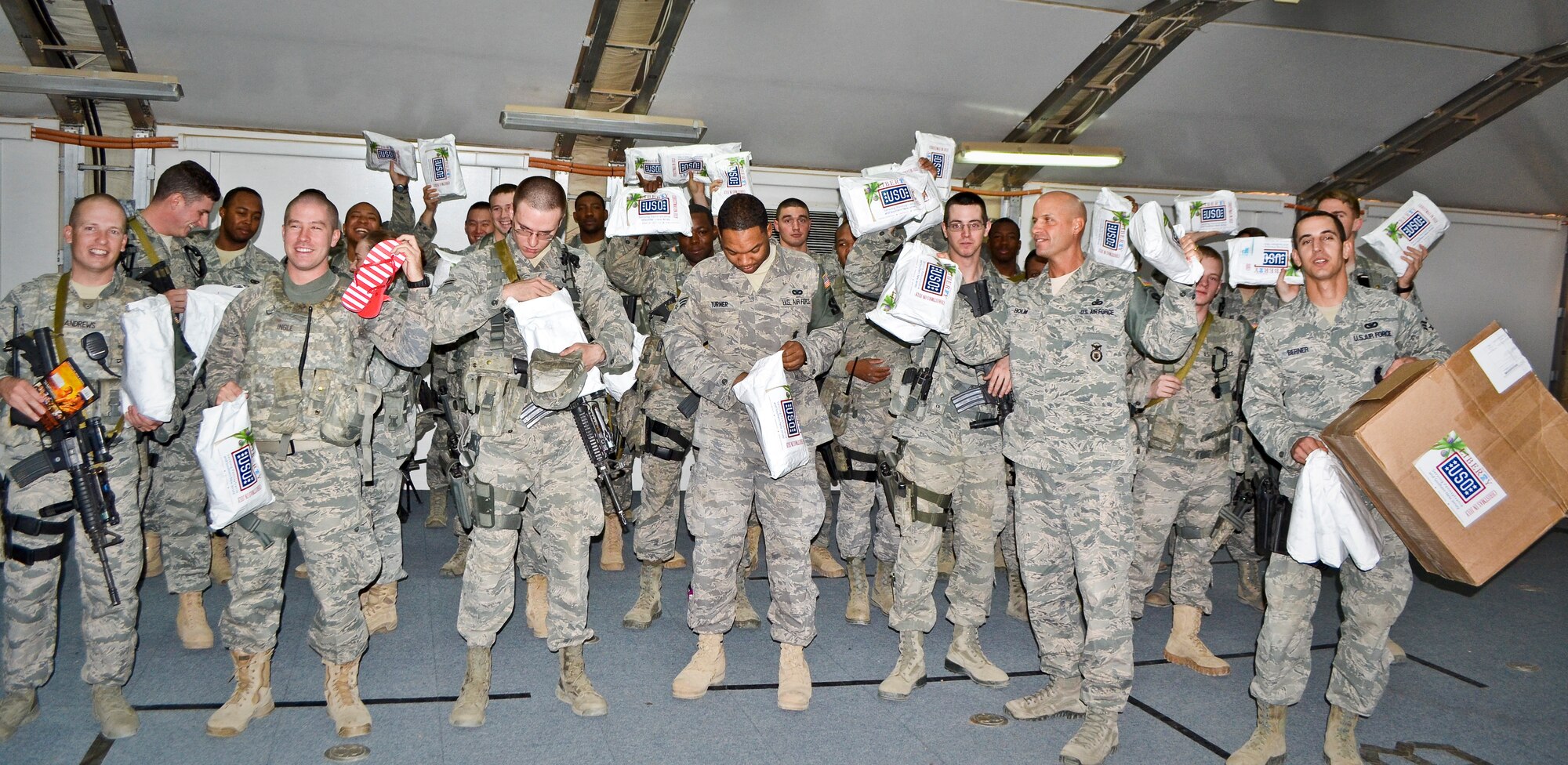 Airmen deployed to the 64th Expeditionary Security Forces Squadron received Christmas-In-July care packages from the United Services Organization, Inc., in Southwest Asia, Aug. 8, 2013. (U.S. Air Force photo/Staff Sgt. Minerva Rosario)