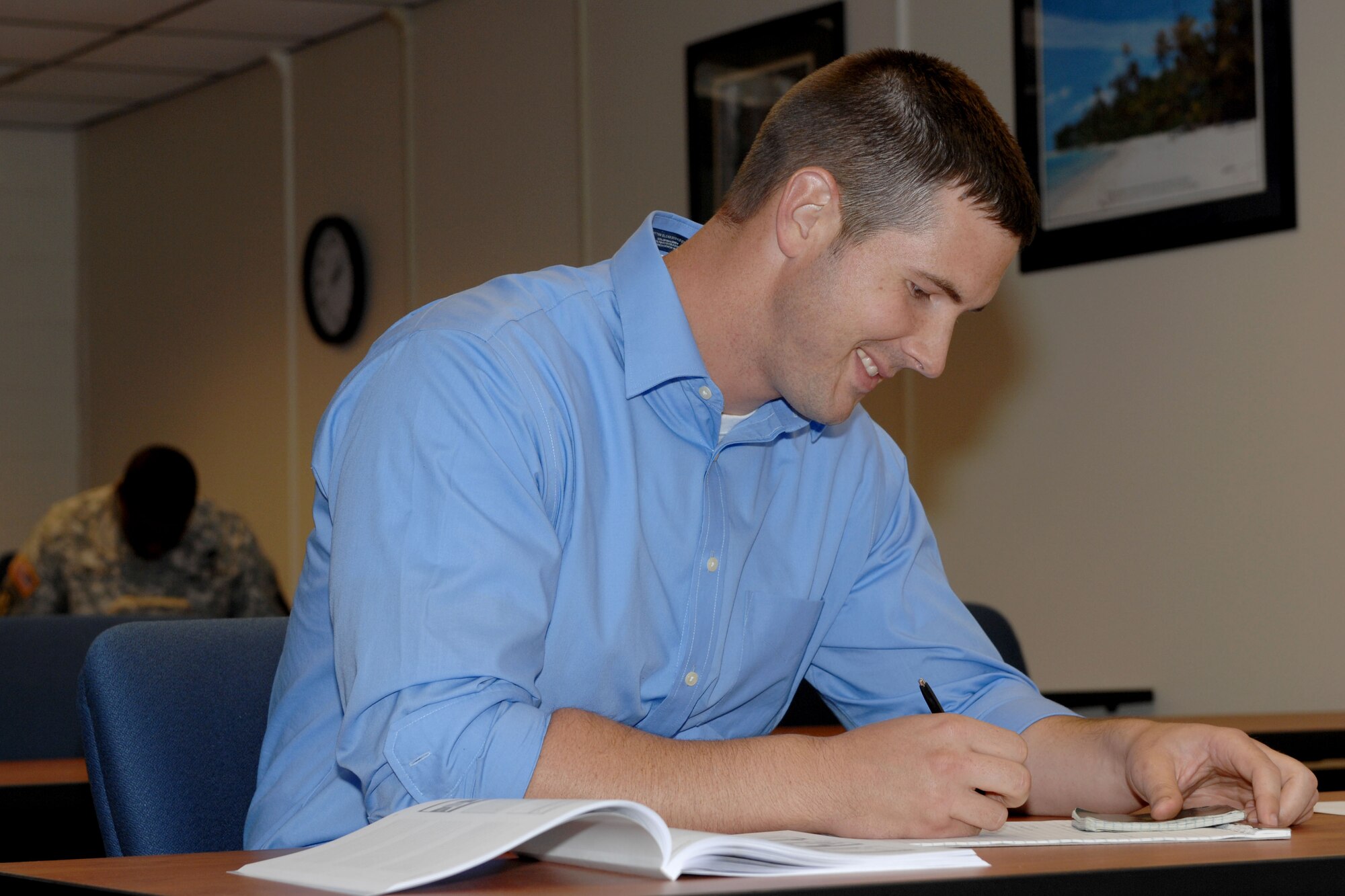 U.S. Navy Petty Officer 2nd Class Matthew Groening, Navy Cargo Handling Battalion 1 Seabee, works on his financial plan at the ACAP (Army Career and Alumni Program) class at Fort Eustis, Va., Aug. 5. 2013. Financial planning, accessing home loans, resume writing and interview tips are some of the many benefits available to transitioning Service members. (U.S. Air Force photo by 2nd Lt. Brooke Betit/Released)