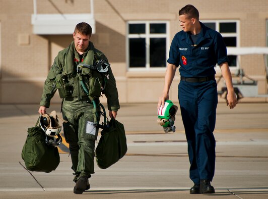 Lt. Cdr. Chris Tabert walks to the flightline to pilot the first F-35C Lightning II flight at Eglin Air Force Base Aug. 14. Before arriving to U.S. Navy F-35 Strike Fighter Squadron VFA 101 in February, he served as a test pilot for the joint strike fighter program at Naval Air Station Patuxent River. He will become the squadron's first instructor pilot and join a collocated team of Marine, Navy, Air Force and international partners training here.  (U.S. Air Force photo/Samuel King Jr.) 
