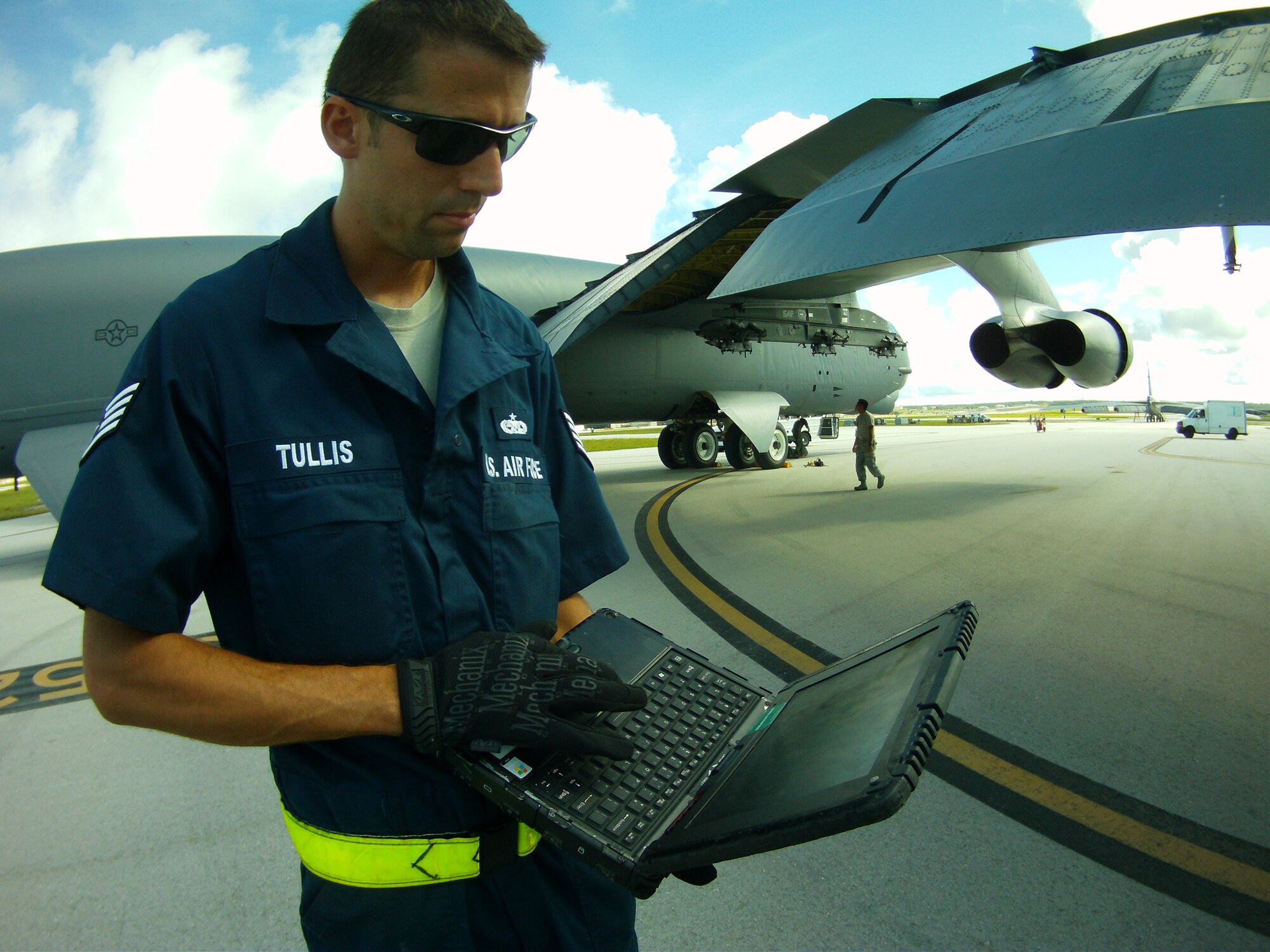 Staff Sgt. Nicholas Tullis, 36th Expeditionary Aircraft Maintenance Squadron, looks over his technical orders before performing maintenance on the B-52 Stratofortress recently on Andersen Air Force Base, Guam. Tullis is deployed from Minot Air Force Base, N.D., in support of U.S. Pacific Command’s continuous bomber presence in the Pacific region. (Courtesy Photo)