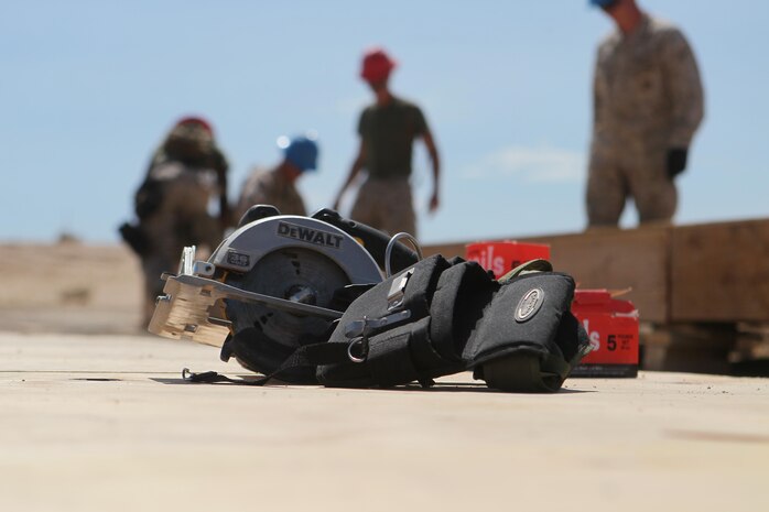 Marine Wing Support Squadron-272 combat engineer Marines build a Southwest Asian Hut so that MWSS-272 aircraft rescue firefighting Marines my later burn it down at Camp Wilson aboard Marine Corps Air-Ground Combat Center Twentynine Palms, Calif., July 29. Both companies are using the hut for training purposes.
