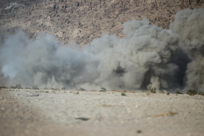 Explosions made by the engineers of Marine Wing Support Squadron 272 during a demolition range at Camp Wilson aboard Marine Corps Air-Ground Combat Center Twentynine Palms, Calif., August 6.