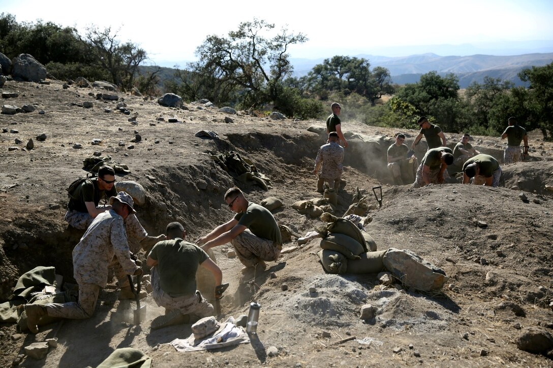 MARINE CORPS BASE CAMP PENDLETON, Calif. – Marines serving with Echo Company, 2nd Battalion, 5th Marine Regiment, fill sandbags to prepare targets and objectives for live-fire training on Range 800 here, Aug. 12, 2013. The company conducted day and night platoon attacks reinforced by a combined anti-armor team, mortar fire and machine gun fire as one of their last training exercises before deploying in support of the 31st Marine Expeditionary Unit. The 31st MEU is capable of conducting limited contingency operations, amphibious operations and crisis response in the Asia-Pacific region.