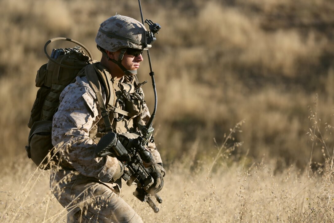 MARINE CORPS BASE CAMP PENDLETON, Calif. – Lance Cpl. Tyler North, a team leader serving with Echo Company, 2nd Battalion, 5th Marine Regiment, and native of San Diego, patrols across the hills of Range 800 here before his platoon begins a live-fire assault, Aug. 14, 2013. The company conducted day and night platoon attacks reinforced by a combined anti-armor team, mortar fire and machine gun fire as one of their last training exercises before deploying in support of the 31st Marine Expeditionary Unit. The 31st MEU is capable of conducting limited contingency operations, amphibious operations and crisis response in the Asia-Pacific region.