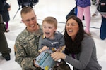 Army Sgt. Adam Rients, from the Kentucky National Guard's Agri-business Development Team 3, enjoys a moment of laughter with his wife, Christy, and his son Jacob, 4. Military spouses have been known for their strength during deployments and Military Spouse Apprectiaon Day seeks to honor the sacrifices and dedication of military spouses.