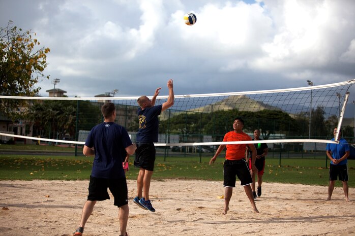 Marine Aviation Logistics Squadron 24 and Marine Corps Air Station Kaneohe Bay compete in volleyball during during the 101 Days of Summer Field Meet Unit Challenge at Riseley Field, Aug. 14, 2013. (U.S. Marine Corps photo by Lance Cpl. Suzanna Knotts)