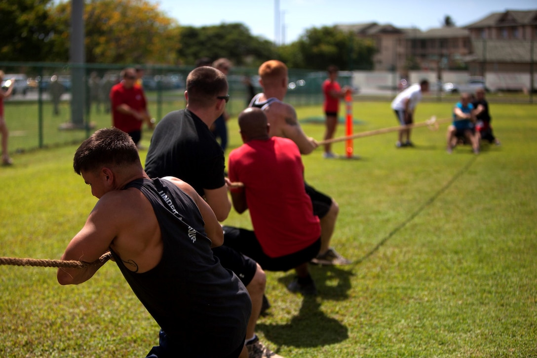 Marine Light Attack Helicopter Squadron 367 battles Marine Corps Air Station Kaneohe Bay in tug of war during the 101 Days of Summer Field Meet Unit Challenge at Riseley Field,  Aug. 14, 2013. (U.S. Marine Corps photo by Lance Cpl. Suzanna Knotts)