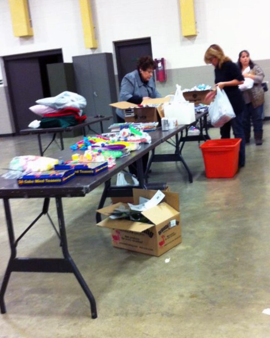 Gail Mann, and Amy Morris, volunteers from the 268th Military Police Company's Family Readiness Group, prepare Christmas stockings Dec. 1, 2011, to send to Soldiers of the 268th Military Police Company, who are currently deployed to Kuwait.