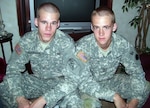 Army Spc. Stephen Shropshire (right) and brother Army Pfc. Joshua B. Shropshire pose stateside for a family photo December 2010. Stephen has since joined the active Army and both have been promoted and are currently deployed to separate posts in Afghanistan.