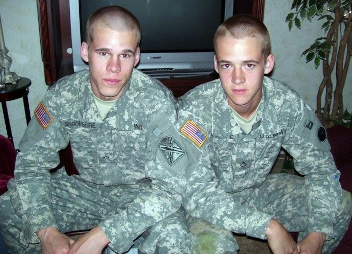 Army Spc. Stephen Shropshire (right) and brother Army Pfc. Joshua B. Shropshire pose stateside for a family photo December 2010. Stephen has since joined the active Army and both have been promoted and are currently deployed to separate posts in Afghanistan.