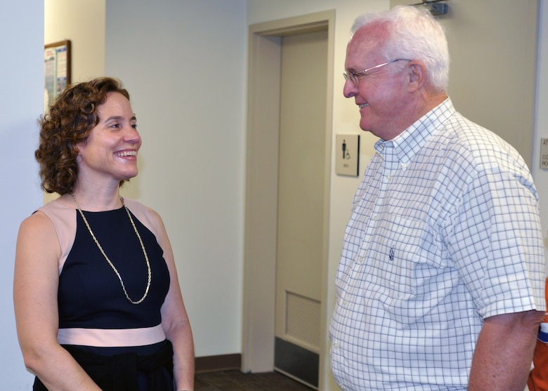 U.S. Army Corps of Engineers employee Kathryn Firsching greets retired employee Bob Miller during a 125th celebration of service to the Cumberland and Tennessee Rivers Basins and to the Nation at an Open House and award ceremony Aug. 15, 2013.
