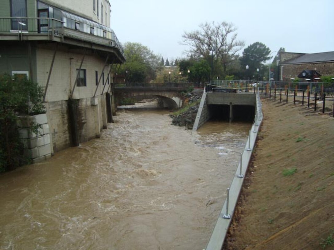 Napa Creek’s widened channel and recently completed box culverts (shown at right) were put to use as rain poured in downtown Napa, Calif., March 14, 2012. The culverts - tunnels large enough for a car to drive through - direct flood water out of Napa Creek and reroute it directly to the Napa River, reducing the chance that the creek will spill over into nearby neighborhoods. The work is part of the $14.8 million, American Recovery and Reinvestment Act of 2009-funded Napa Creek Project, a joint effort of the U.S. Army Corps of Engineers Sacramento District, the city of Napa, and the Napa Flood Control and Water Conservation District to reduce the flood risk for the city. 