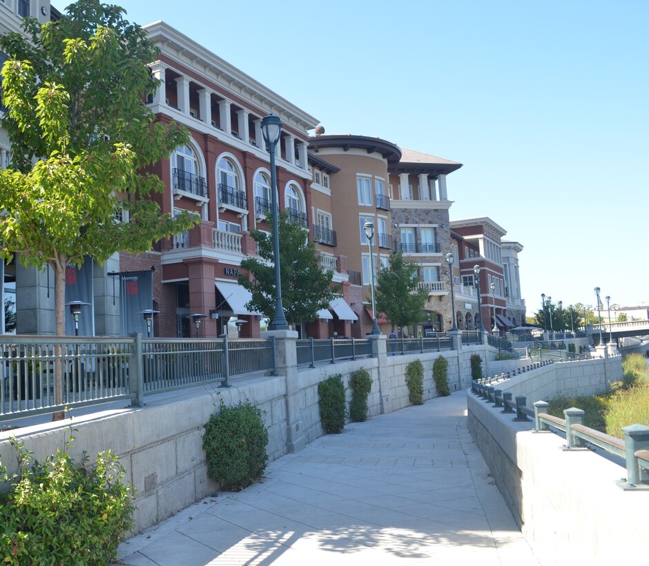 A view of the terraced flood wall that also serves as walking path along the river.