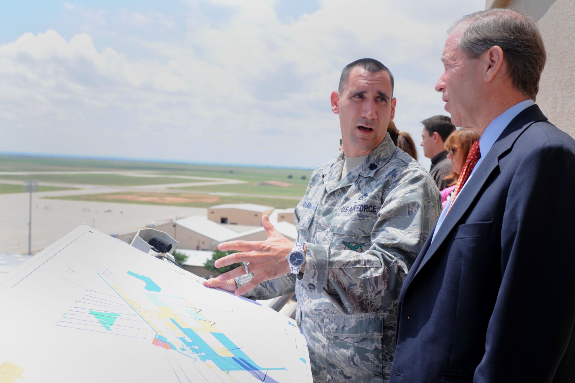 U.S. Air Force Lt. Col Anthony Figiera, 27th Special Operations Civil Engineer Squadron commander, shows U.S. Senator Tom Udall, senior senator from New Mexico, various ongoing construction projects and new developments, Aug. 14, 2013 at Cannon Air Force Base, N.M. Udall’s visit to Cannon allowed him to gain a better understanding of current 27th Special Operations Wing mission operations. (U.S. Air Force photo/ Senior Airman Ericka Engblom)