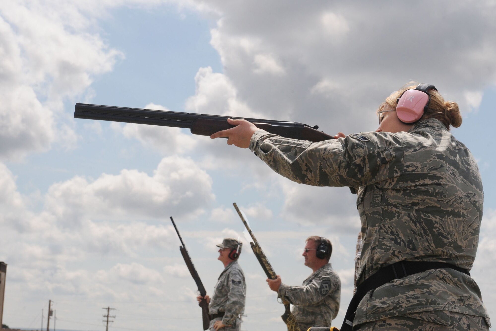 Airman 1st Class Amber Murry, 28th Communication Squadron cyber transport system technician, fires a shotgun during the Command Chief Challenge at the Trap and Skeet range on Ellsworth Air Force Base, S.D. Aug. 9, 2013. The event was designed to test the Airmen’s skills and coordination while providing an opportunity to interact with base leaders. (U.S. Air Force photo by Airman 1st Class Rebecca Imwalle/Released)