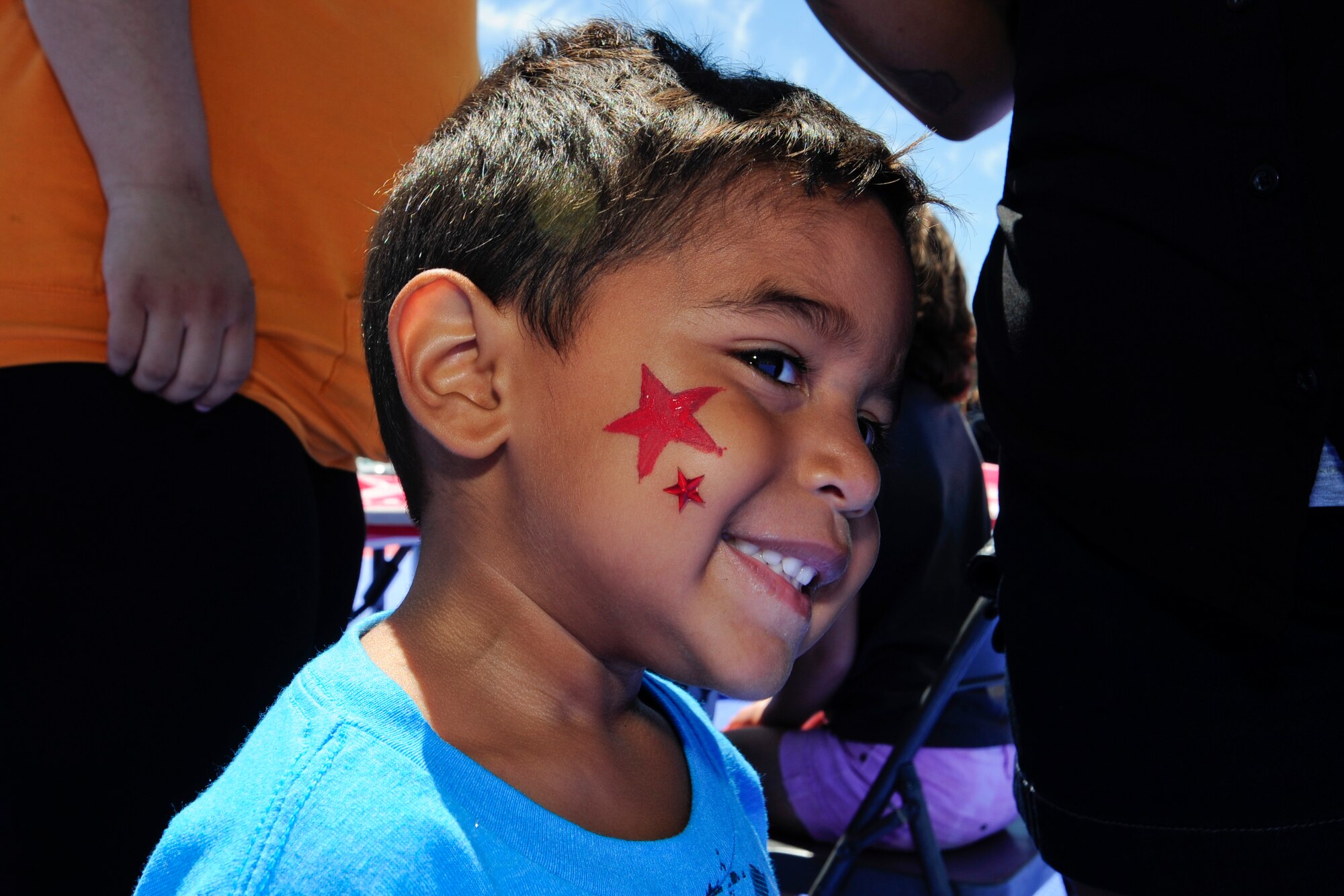 VANDENBERG AIR FORCE BASE, Calif. – Gabriel Peraza shows off his face painting during the 4th annual Salute to Youth event here Thursday, August 15, 2013. Salute to Youth was both an educational and family friendly event. It hosted the Exceptional Family Member Program, local schools, Backpack Brigade, food, games and prizes. (U.S. Air Force photo/Airman Yvonne Morales)