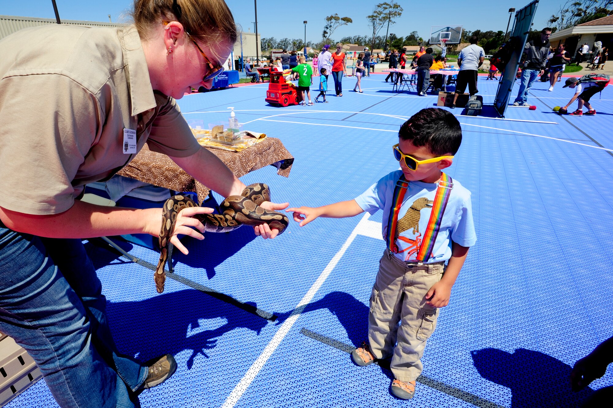 VANDENBERG AIR FORCE BASE, Calif. – Ryan Massaro pets a 13 year-old African Python from Charles Paddock Zoo during the 4th annual Salute to Youth event here Thursday, August 15, 2013. Salute to Youth was both an educational and family friendly event. It hosted the Exceptional Family Member Program, local schools, Backpack Brigade, food, games and prizes. (U.S. Air Force photo/Airman Yvonne Morales)