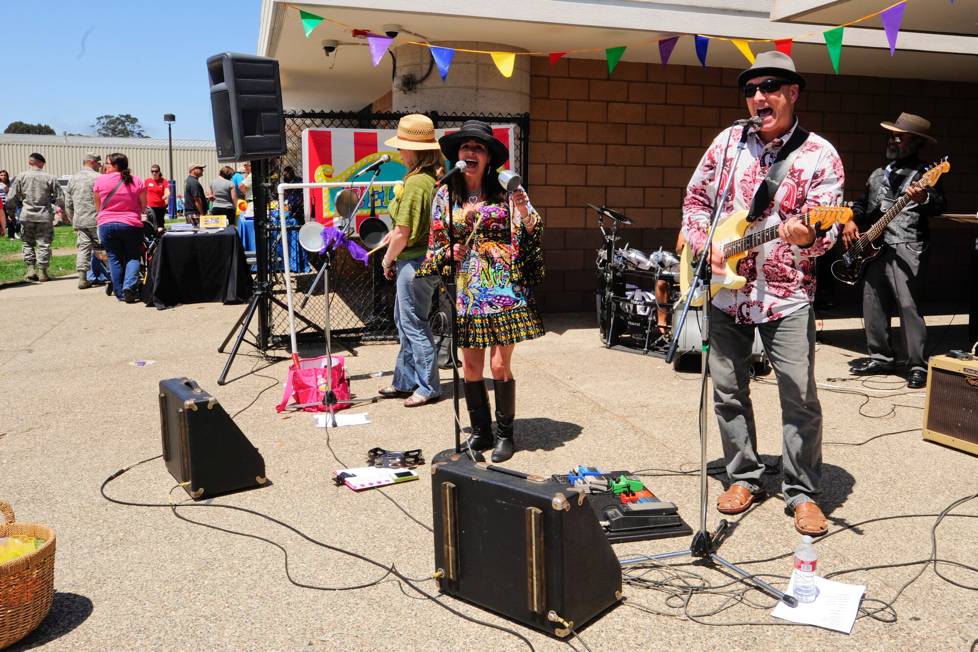 VANDENBERG AIR FORCE BASE, Calif. – Birdie, a kids music band, perform during the 4th annual Salute to Youth event here Thursday, August 15, 2013. Salute to Youth was both an educational and family friendly event. It hosted the Exceptional Family Member Program, local schools, Backpack Brigade, food, games and prizes. (U.S. Air Force photo/Airman Yvonne Morales)