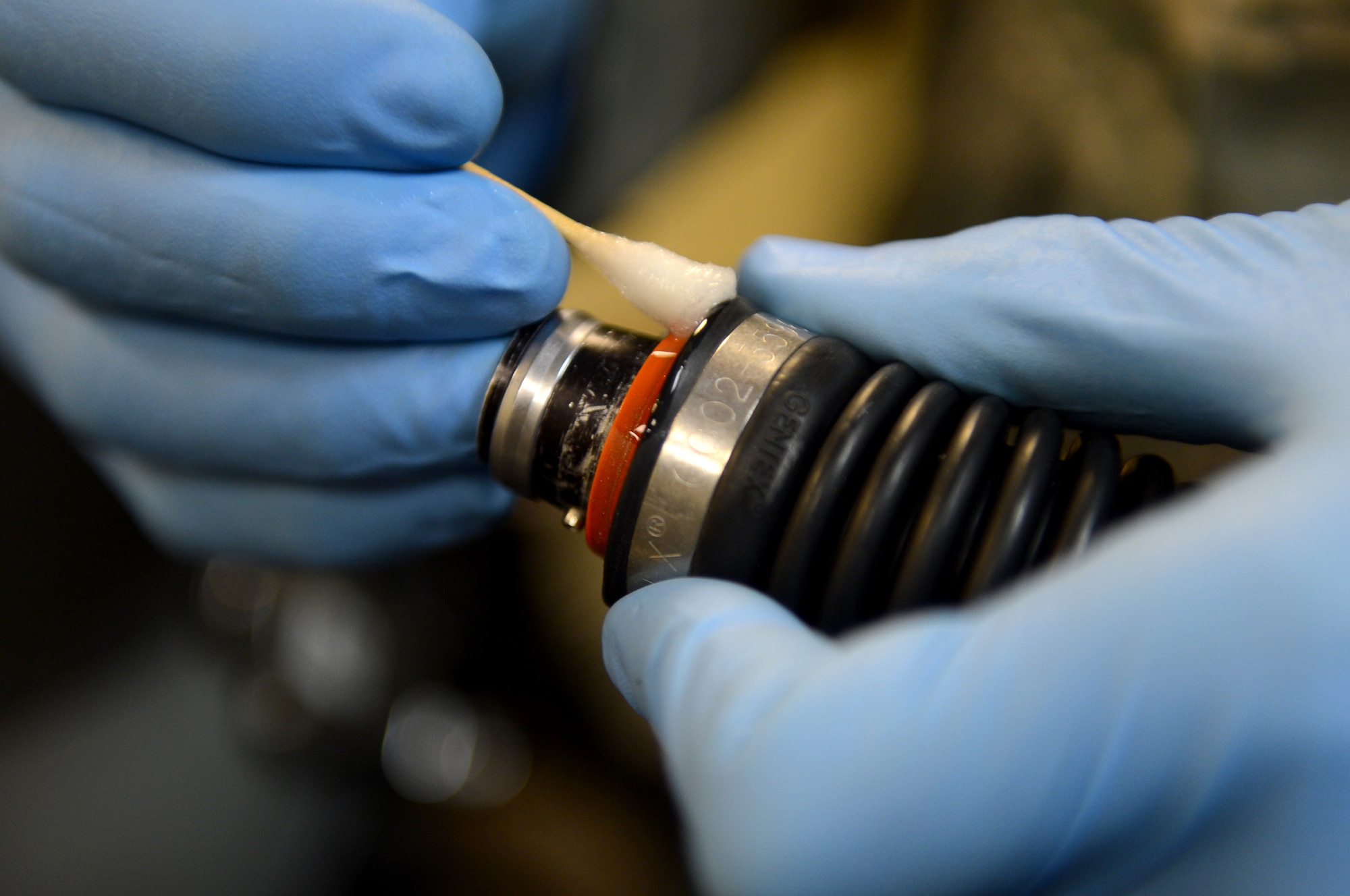 Airman 1st Class Michael Fields, 2nd Operations Support Squadron flight equipment journeyman, cleans part of an oxygen mask on Barksdale Air Force Base, La., Aug. 16, 2013. Helmets and oxygen masks are disassembled, cleaned and inspected every 30 days. (U.S. Air Force photo/Senior Airman Micaiah Anthony)