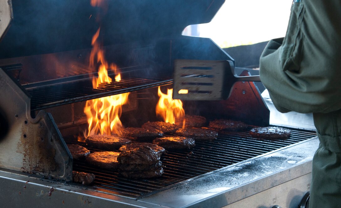 Burgers burn for a fundraiser held behind the Student Squadron building here, Aug. 16, 2013. The fundraiser was held by the 434th and 85th Flying Training Squadrons in support of the Feds Feed Families campaign. (U.S. Air Force photo/Airman 1st Class Jimmie D. Pike)