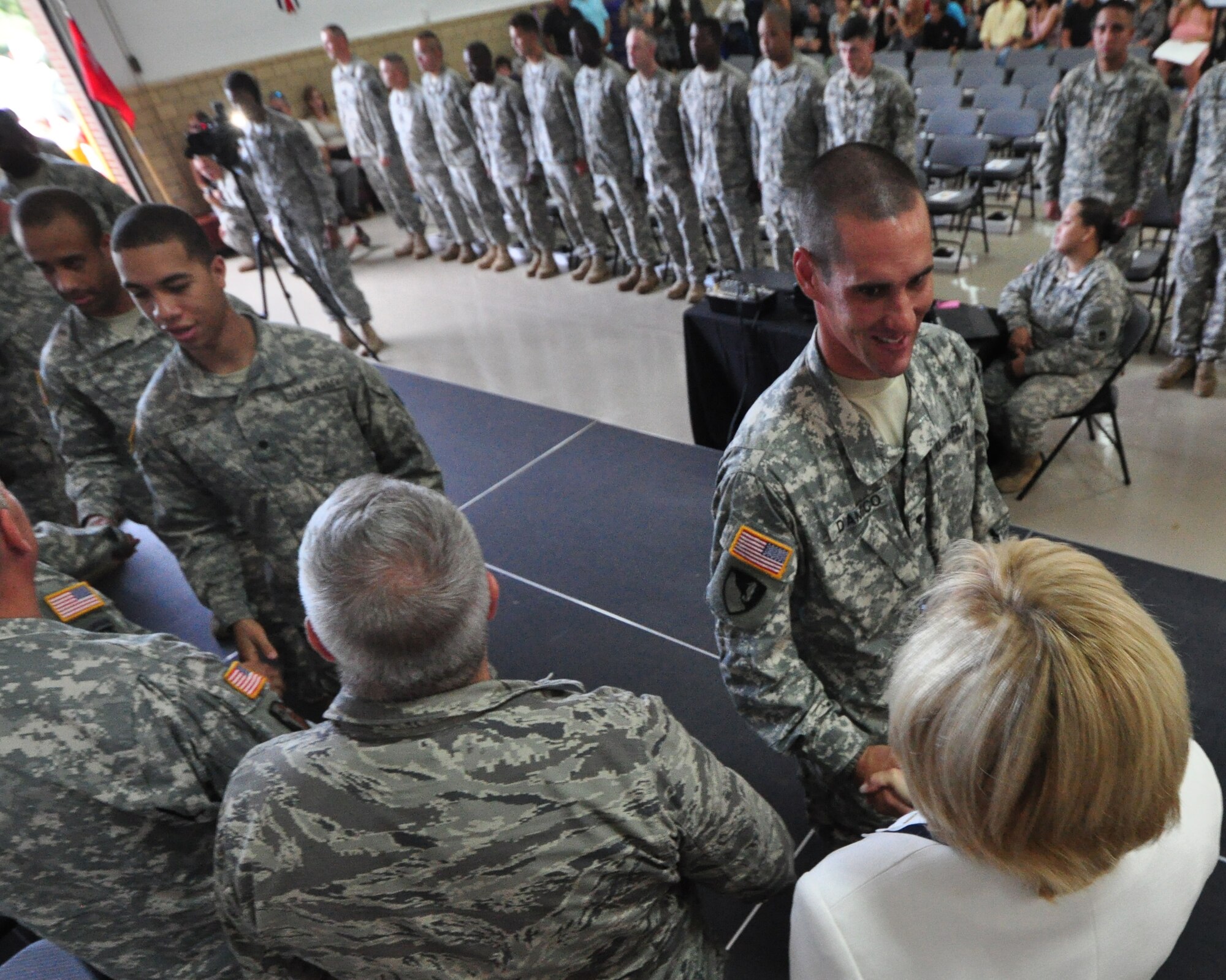 Spc. James DiAmico shakes hands with New Jersey Lt. Gov. Kim Guadagno at the 150th Engineer Company sendoff Aug. 10, 2013, in Bordentown, N.J. U.S. Army photo by Sgt. 1st Class Kryn P. Westhoven/Released)