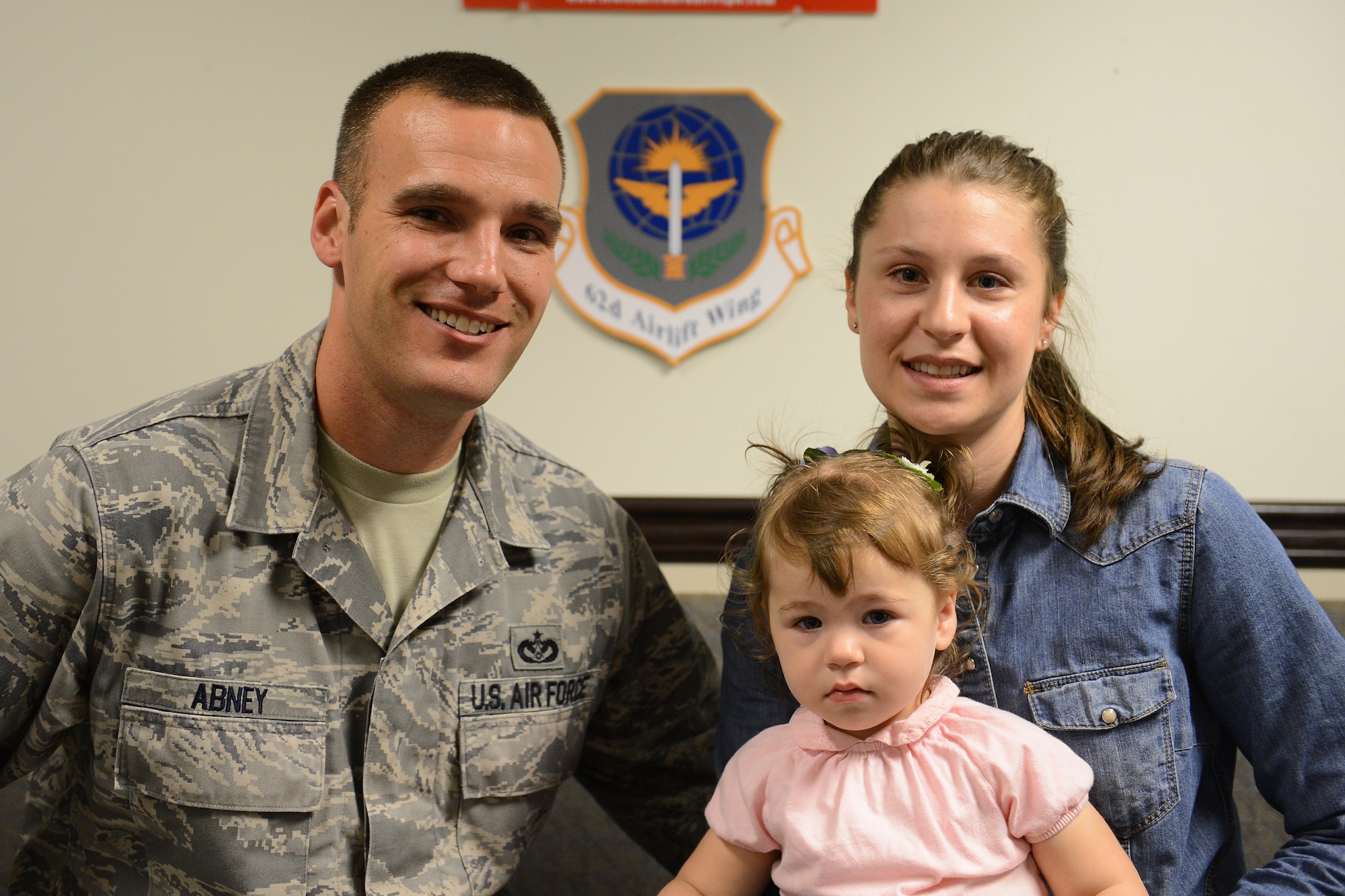 Marion Abney (right), 627th Civil Engineering Squadron key spouse and spouse of Tech. Sgt. James Abney, 627th CES unit deployment manager and their daughter pause for a family portrait Aug. 14, 2013 at Joint Base Lewis-McChord, Wash. Mrs. Abney was highlighted as Team McChord’s key spouse of the week. (U.S. Air Force photo/Airman 1st Class Jacob Jimenez)  