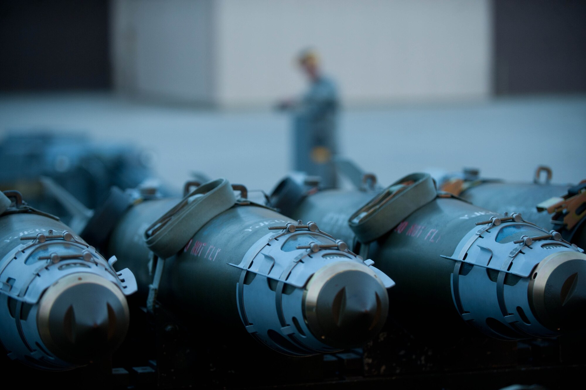 Inert guided bomb units are ready to be loaded into a mock B-1 bomber simulator by weapons load crew Airmen during training at Ellsworth Air Force Base, S.D., Aug. 13, 2013. Weapons load crew Airmen enable each B-1 bomber to deliver a payload of up to 75,000 pounds to mission targets. (U.S. Air Force photo by Airman 1st Class Zachary Hada/Released)