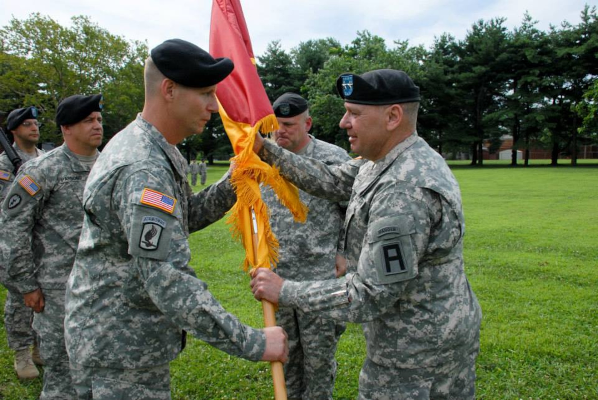 Col. John Lange accepts the colors of the 72nd Operations Brigade from Maj. Gen. Kevin Wendel, First Army Division East commander, during the brigade’s change of command ceremony July 24, 2013, at Sharp Field on Joint Base McGuire-Dix-Lakehurst, N.J. (U.S. Army courtesy photo/Released)