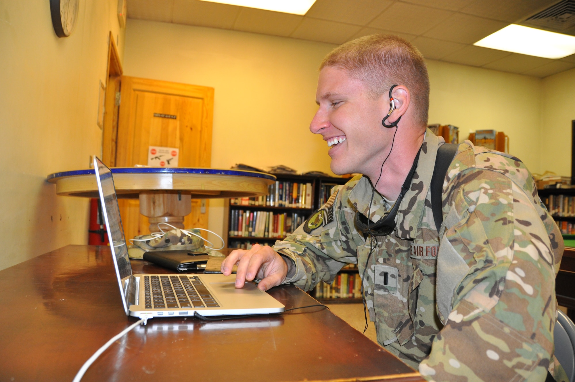 1st Lt. Jonathan, 4th Expeditionary Reconnaissance Squadron pilot, talks with his siblings via FaceTime from the Vulture’s Nest recreation center on Bagram, Airfield, Afghanistan, Aug. 15. Deployments are a little easier for Airmen and their loved ones at home when they make time to keep in touch. (U.S. Air Force photo/Tech. Sgt. Rob Hazelett)