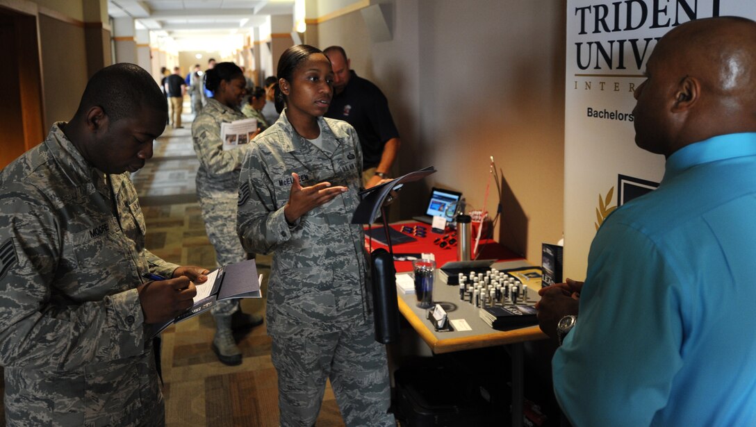 Airmen learn about the educational opportunities available to them during an education fair in the Rushmore Center at Ellsworth Air Force Base, S.D., Aug. 14, 2013. During the event, educators and guidance counselors who represent a wide variety of universities from across the Black Hills including American Military, Ashford, Columbia Southern, Embry Riddle Aeronautical and Kaplan were present to help Airmen register for classes. (U.S. Air Force photo by Airman 1st Class Hrair H. Palyan/Released)