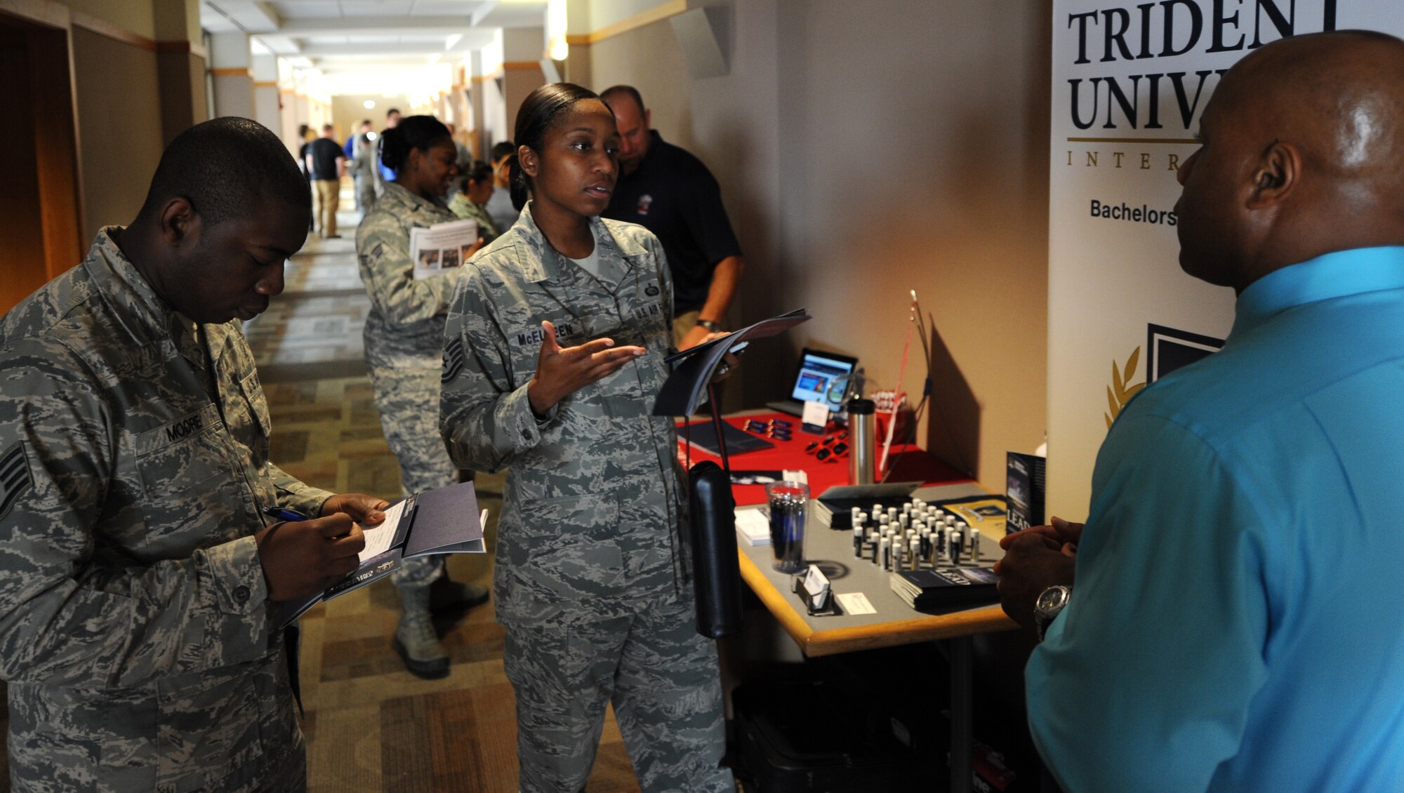 Airmen learn about the educational opportunities available to them during an education fair in the Rushmore Center at Ellsworth Air Force Base, S.D., Aug. 14, 2013. During the event, educators and guidance counselors who represent a wide variety of universities from across the Black Hills including American Military, Ashford, Columbia Southern, Embry Riddle Aeronautical and Kaplan were present to help Airmen register for classes. (U.S. Air Force photo by Airman 1st Class Hrair H. Palyan/Released)