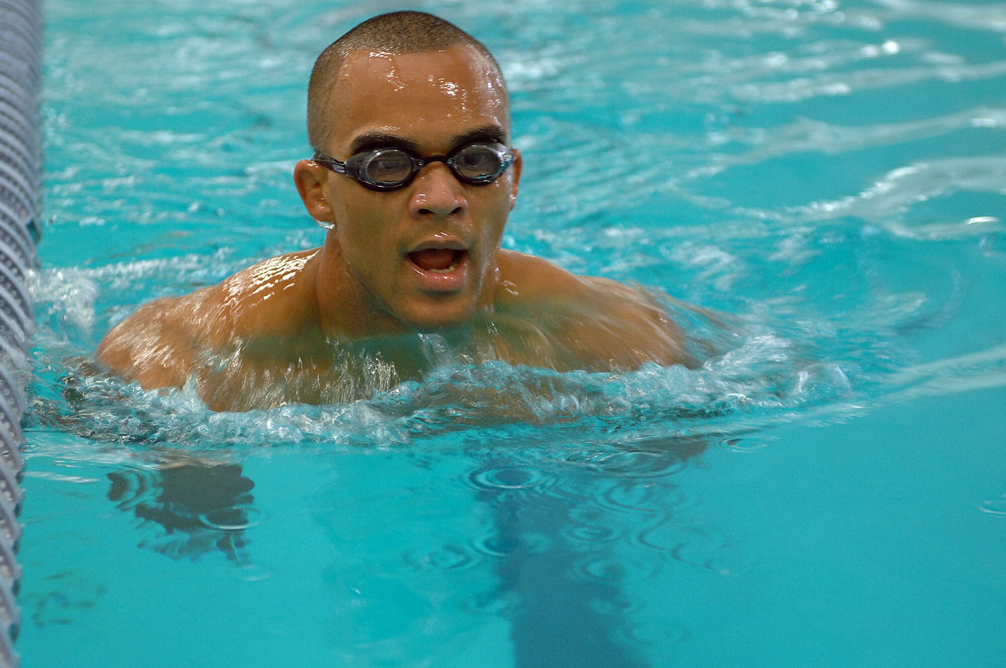 U.S. Air Force Senior Airman Jordan Hansen-Lewis, 4th Aircraft Maintenance Squadron avionics systems apprentice, swims during a portion of a Physical Ability and Stamina Test in Goldsboro, N.C., Aug. 12, 2013.  The Airmen had to complete two 25-meter underwater swims and a 500-meter surface swim using only a freestyle, breaststroke or sidestroke.  (U.S. Air Force photo by Airman 1st Class Brittain Crolley/Released)