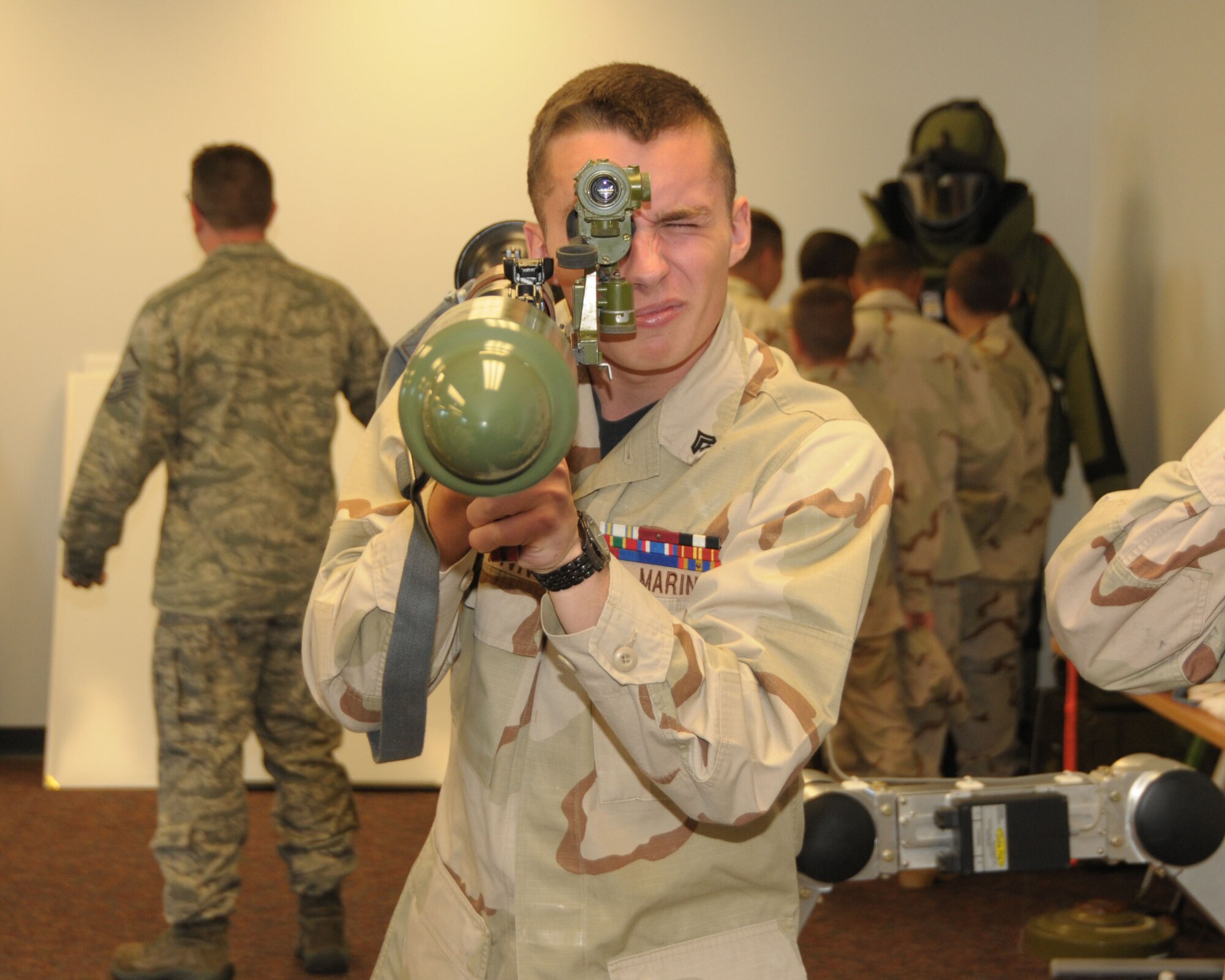 A member of the Niagara Youth Marine Cadets inspects a training rocket propelled grenade launcher while on tour at the Niagara Falls Air Reserve Station on August 15, 2013. The group visited the base recently which included s security forces, fire fighting, and explosive ordinance disposal demonstration. (U.S. Air Force photo by Peter Borys)