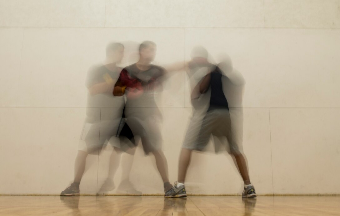 U.S. Air Force Airman 1st Class Conor Fergus, 75th Aircraft Maintenance Unit aircraft armament journeyman, throws a jab at Staff Sgt. Edgar Sotelo, 75th Aircraft Maintenance Unit crewchief, in the Freedom I Fitness Center at Moody Air Force Base, Ga., June 26, 2013. Many fighters use the jab to set up combinations and create openings. (U.S. Air Force photo by Senior Airman Douglas Ellis/Released)
