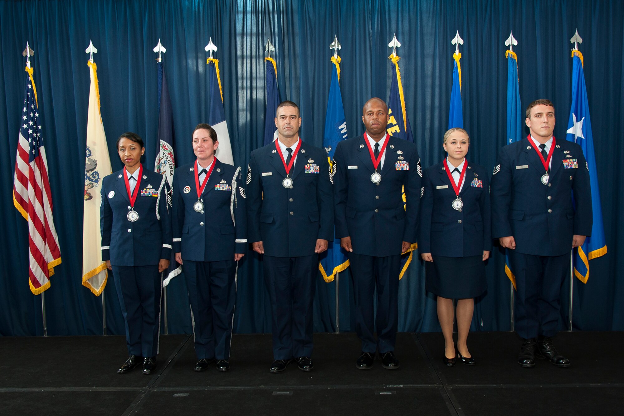 The six Outstanding Air National Guard Airmen of the Year are recognized with awards for excellence during the Director's All-Call event at the ANG Readiness Center, Joint Base Andrews Md. August 14, 2013. (left to right) Master Sgt. Olympia D. Williamson, 136th Airlift Wing, Texas ANG, Technical Sgt. Jamie L. Jones, 108th Refueling Wing, New Jersey ANG, Senior Master Sgt. Mike A. Schmaling, 128th Refueling Wing, Wisconsin ANG, Master Sgt. Andre S. Davis from the 203rd RED HORSE (Rapid Engineer Deployable, Heavy Operational Repair Squadron, Engineer) Virginia ANG, Technical Sgt. Melissa A. Knight, 185th Refueling Wing, Iowa ANG, Staff Sgt. Chadwick Boles from the 125th Special Tactics Squadron, Oregon ANG. (U.S. Air National Guard photo by Master Sgt. Marvin R. Preston/RELEASED)