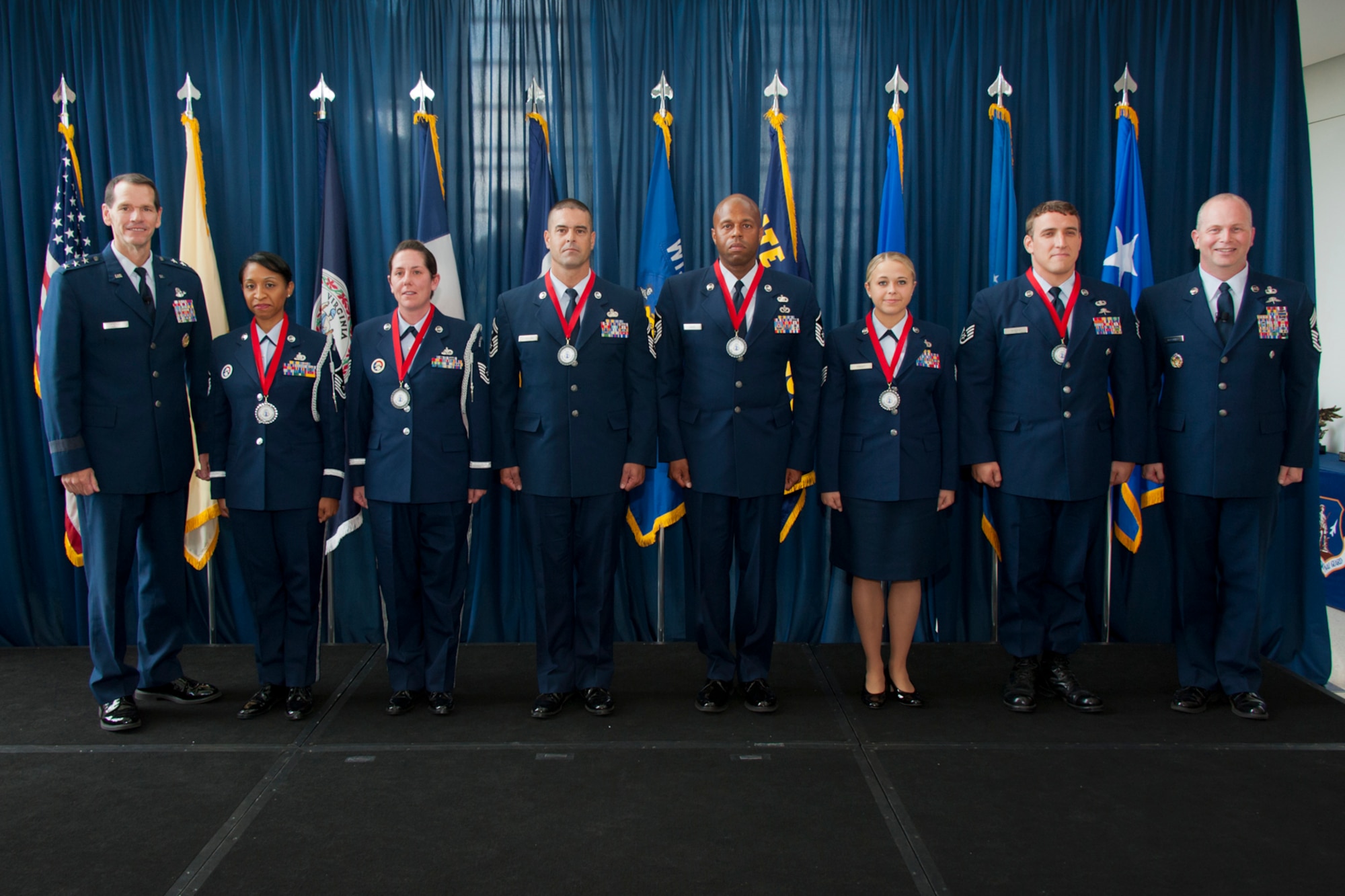 Lt. Gen. Stanley E. Clarke III; the director of the Air National Guard(left) and Chief Master Sergeant James W. Hotaling; Air National GuardCommand Chief (far right); recognize the six Outstanding Airmen of the Year with awards for excellence during the Director's All-Call event at the ANG Readiness Center; Joint Base Andrews Md. August 14; 2013. (left to right)Master Sgt. Olympia D. Williamson; 136th Airlift Wing; Texas ANG; TechnicalSgt. Jamie L. Jones; 108th Refueling Wing; New Jersey ANG; Senior MasterSgt. Mike A. Schmaling; 128th Refueling Wing; Wisconsin ANG; Master Sgt.Andre S. Davis from the 203rd RED HORSE (Rapid Engineer Deployable; Heavy Operational Repair Squadron; Engineer) Virginia ANG; Technical Sgt. MelissaA. Knight; 185th Refueling Wing; Iowa ANG; Staff Sgt. Chadwick Boles fromthe 125th Special Tactics Squadron; Oregon ANG. (U.S. Air National Guardphoto by Master Sgt. Marvin R. Preston/RELEASED)