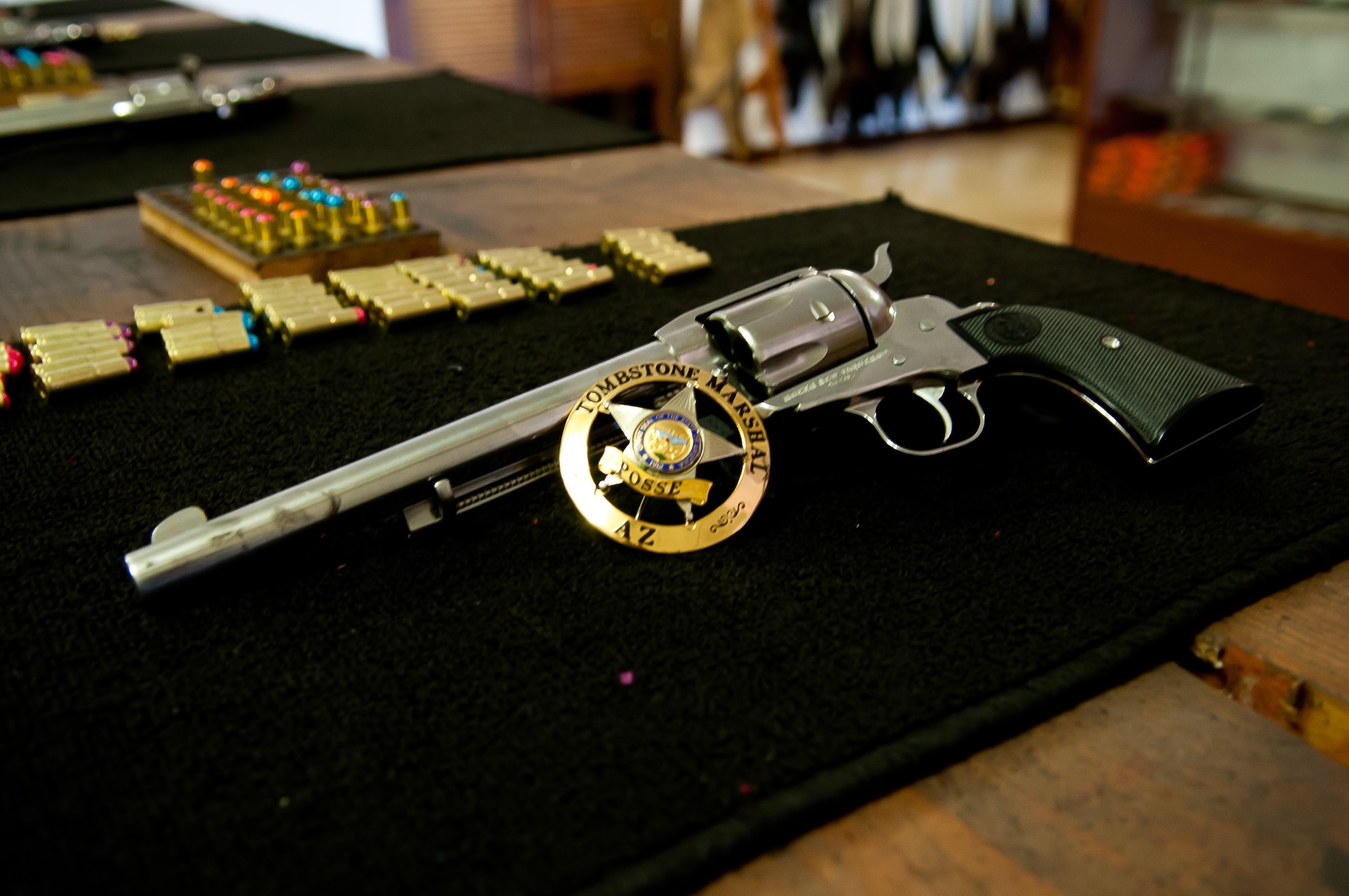 Pistols and paint rounds are neatly laid out at the Big Iron Shooting Gallery. Visitors can fire six rounds for $3. (U.S. Air Force photo/Staff Sgt. Nestor Cruz)