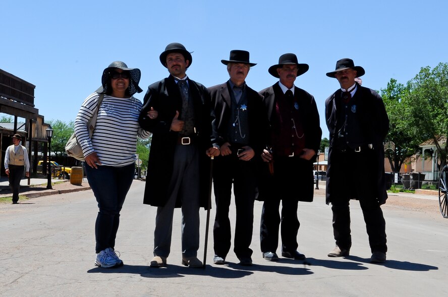 Actors dressed as Doc Holliday and the Earp brothers pose for a photo with a visitor on the main street of Tombstone. Re-enactments of the legendary “Gunfight at OK Corral” are held inside the OK Corral on Allen Street at noon, 2 and 3:30 p.m. most days. (U.S. Air Force photo/Staff Sgt. Nestor Cruz)