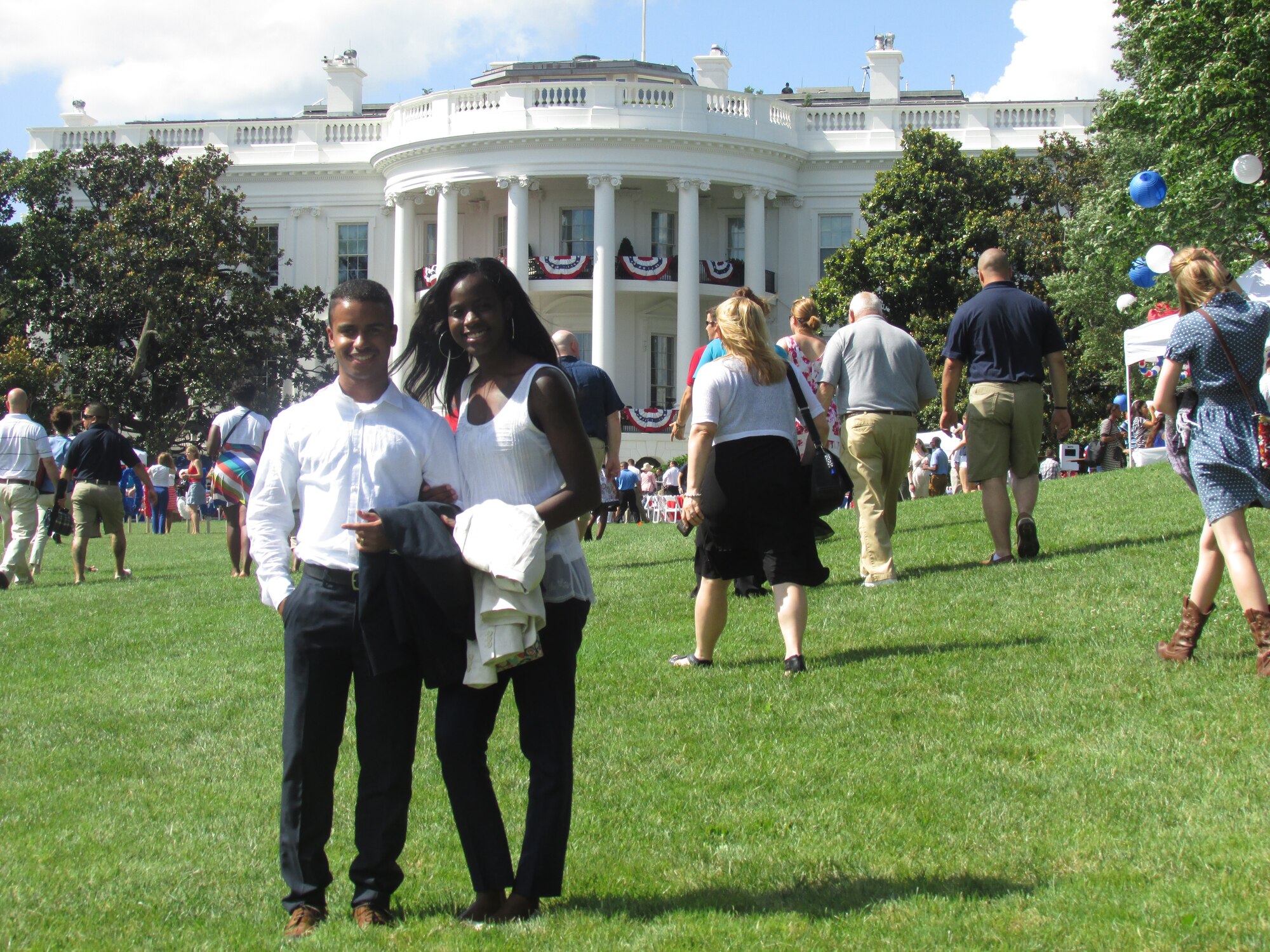 U.S. Air Force Airmen 1st Class Joe, 4th Logistics Readiness Squadron knowledge operations management apprentice, and Shela Martinez, 4th Force Support Squadron military personnel section customer support representative, attend the White House 4th of July Salute to the Military event in Washington D.C., July 4, 2013. Several members of Team Seymour were invited to attend the occasion as a thank you for their military service. (Courtesy photo)