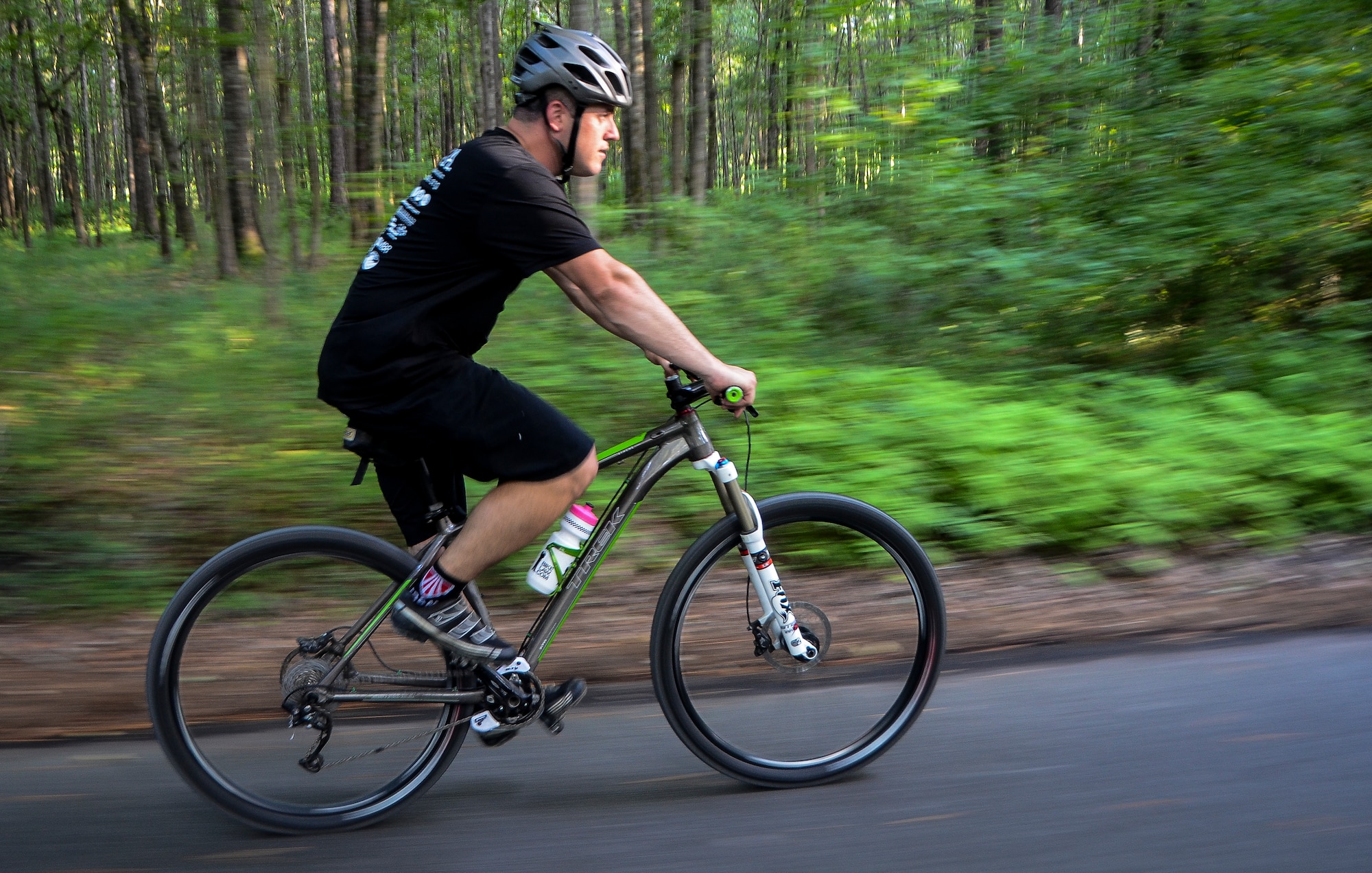 Tech. Sgt. Nathan Swab, 628th Communications Squadron quality assurance evaluator and a Low Country Fat Tire Freaks member, rides his bike Aug. 13, 2013, at Marrington Plantation on Joint Base Charleston - Weapons Station, S.C. The Marrington trail system is more than 19 miles long and has an average of 6,000 visitors a year. The LCFTF is a group of volunteers who help maintain the trails. (U.S. Air Force photo/Senior Airman Jared Trimarchi) 