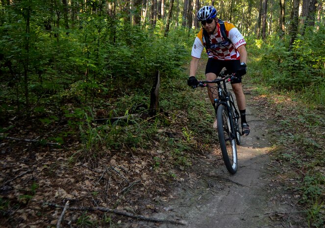 Jon Finney, a member of the Low Country Fat Tire Freaks, rides the trails Aug. 11, 2013, at Marrington Plantation on Joint Base Charleston - Weapons Station, S.C. The Marrington trail system is more than 19 miles long and has an average of 6,000 visitors a year. The LCFTF is a group of volunteers who help maintain the trails. (U.S. Air Force photo/Senior Airman Jared Trimarchi) 