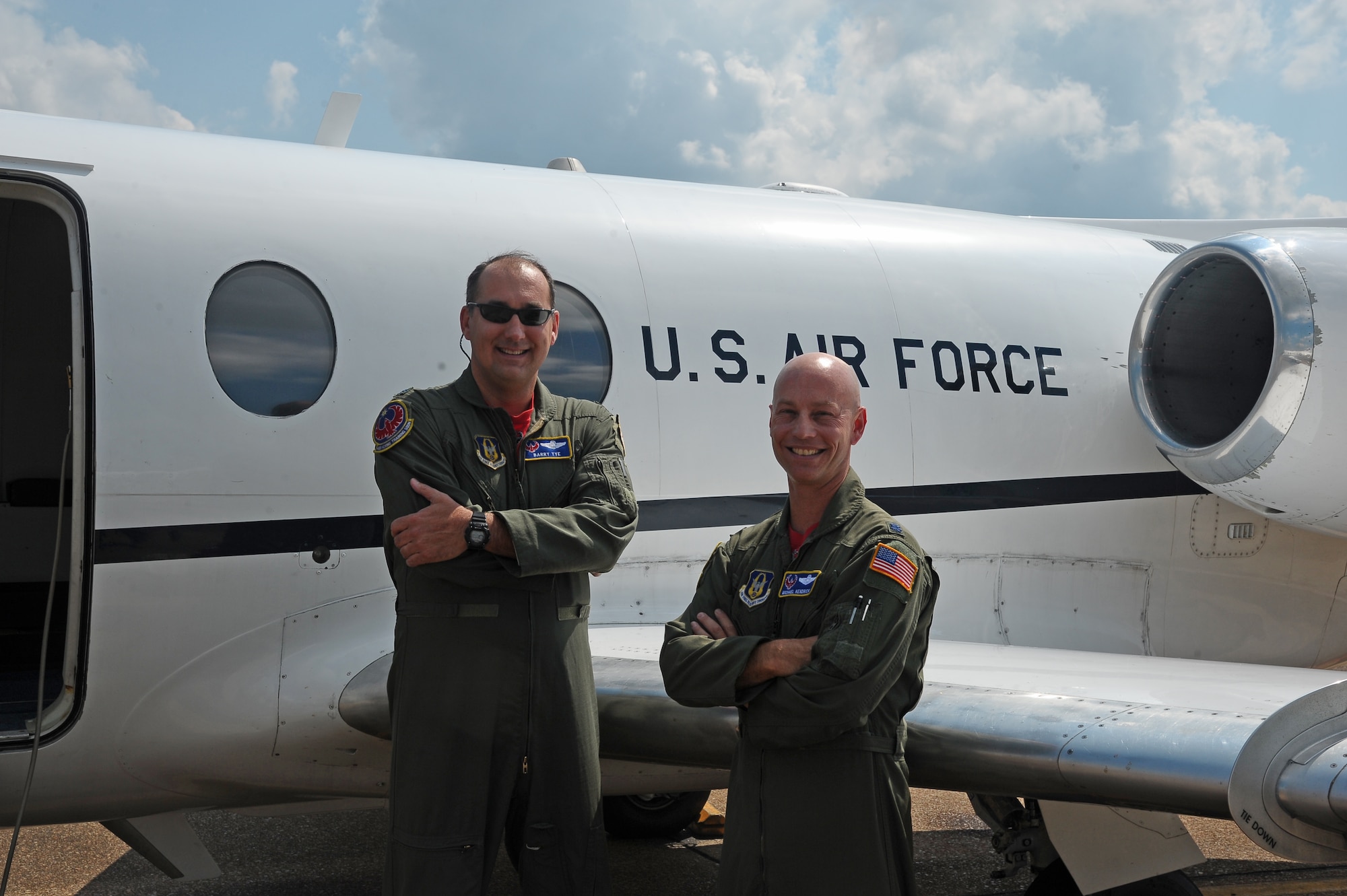 Lt. Col. Barry Tye and Lt. Col. Michael Kendrick, both from the 43rd Flying Training Squadron, pause in front of a T-1 after their fini-flights August 14 on the Columbus Air Force Base flight line. Tye and Kendrick are both retiring after 19 years of serving Columbus Air Force Base. They have each flown over 4,000 hours in a T-1 at Columbus Air Force Base. (U.S. Air Force Photo/Airman 1st Class Stephanie Englar)
