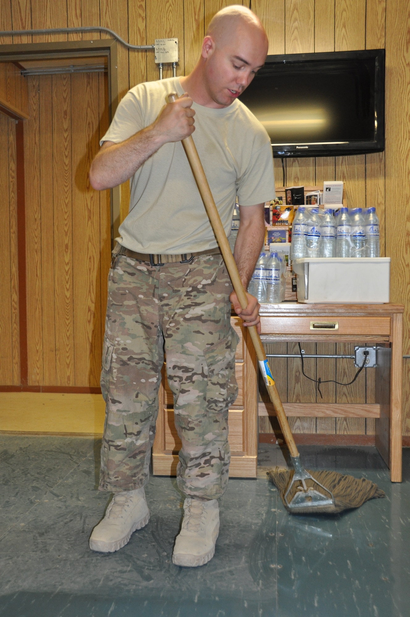 Staff Sgt. Lowell Wann, 455th Air Expeditionary Wing chaplain assistant, is deployed to Bagram Airfield, Afghanistan, from Buckley Air Force Base, Colo. The Odessa, Mo., native helped organize the 'Spring Cleaning in the Fall' project and volunteered his time during to help improve the Airman Ministry Center here Aug. 16, 2013. (U.S. Air Force Photo/Tech. Sgt. Rob Hazelett)