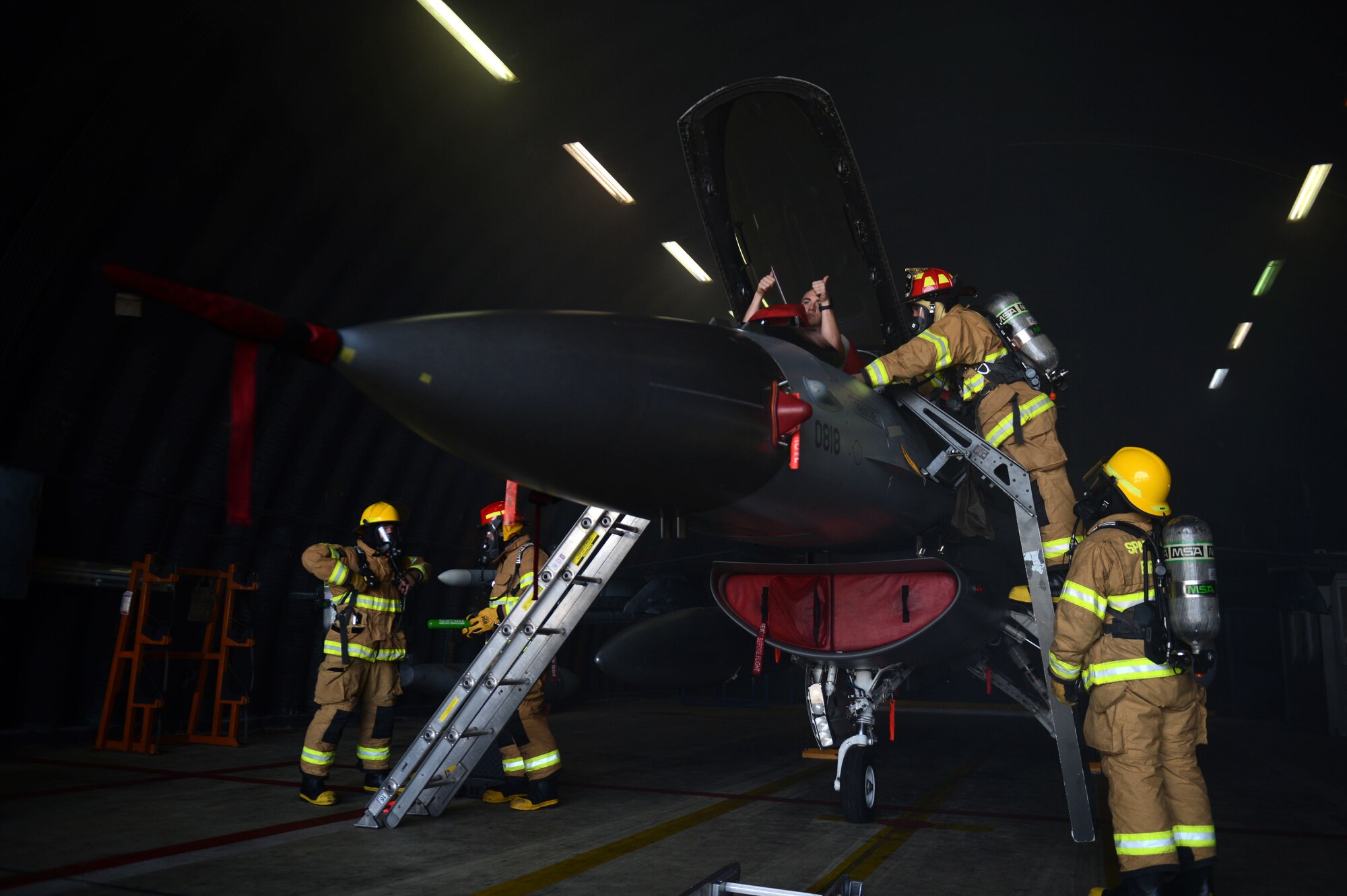 SPANGDAHLEM AIR BASE, Germany – Firefighters from the 52nd Civil Engineer Squadron participate in an aircraft fire training exercise Aug. 14, 2013. Training on aircraft disasters is held every week in the 52nd CES. (U.S. Air Force photo by Airman 1st Class Gustavo Castillo/Released)