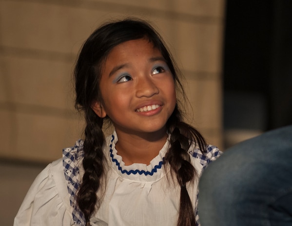 Alyza Ablang, daughter of Master Sgt. Maria Ablang, 628th Aerospace Medicine Squadron, and Tech. Sgt. Paolo Ablang, 628th AMDS, plays Dorothy in the stage production of “The Wizard of Oz” Aug. 2, 2013, produced by Missoula Children's Theatre and the Youth Programs Center at Joint Base Charleston- Weapons Station, S.C. The Missoula Children's Theatre International Tour has fostered development life skills in more than a million children. This year alone, the Missoula Children Theatre will work with 65,000 children in more than 1,200 communities in all 50 states and 17 countries. (U.S. Air Force photo/Senior Airman Ashlee Galloway)