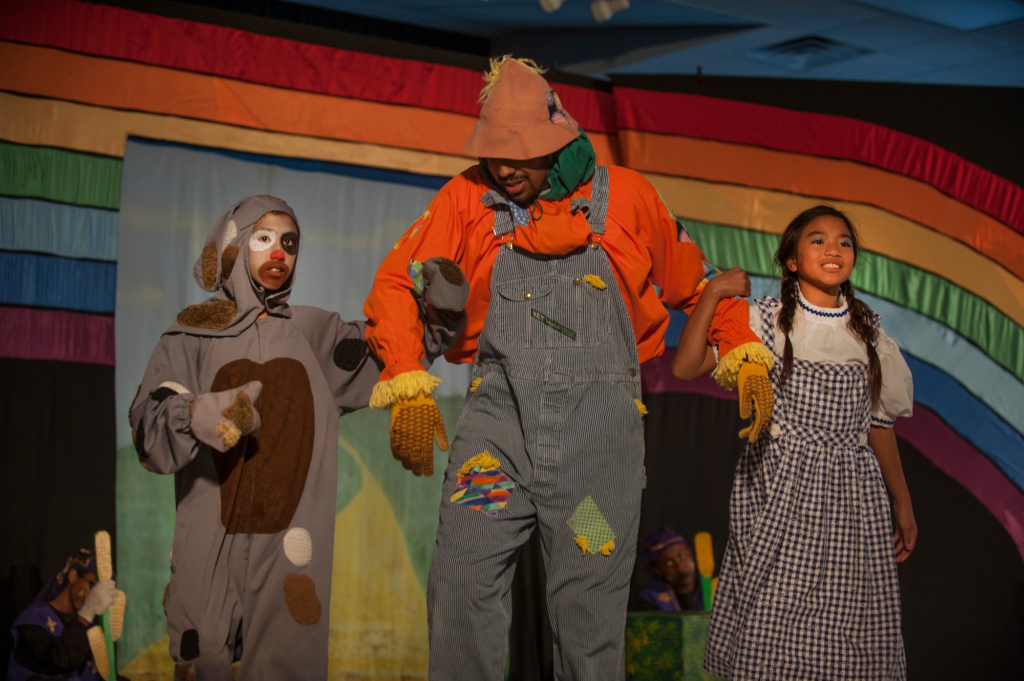 Toto, played by Caitlin Ashbaugh (left), daughter of Christy Ashbaugh, and Dorothy, played by Alyza Ablang (right), daughter of Master Sgt. Maria Ablang, 628th Aerospace Medicine Squadron, and Tech. Sgt. Paolo Ablang, 628th AMDS, participate in the stage production of “The Wizard of Oz” Aug. 2, 2013, produced by the Missoula Children's Theatre and the Youth Programs Center at Joint Base Charleston- Weapons Station, S.C. The Missoula Children's Theatre International Tour has fostered development life skills in more than a million children. This year alone, the Missoula Children Theatre will work with 65,000 children in more than 1,200 communities in all 50 states and 17 countries. (U.S. Air Force photo/Senior Airman Ashlee Galloway)