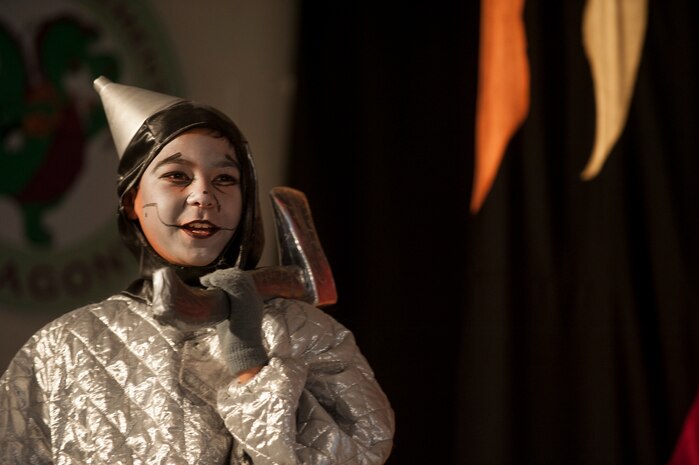 The Tin Man, played by Nathan Guenther, son of Master Sgt. Cao Nguyen, 437th Maintenance Squadron Operation Controls, participates in the stage production of the “The Wizard of Oz” Aug. 2, 2013, produced by the Missoula Children's Theatre and the Youth Programs Center at Joint Base Charleston- Weapons Station, S.C. The Missoula Children's Theatre International Tour has fostered development life skills in more than a million children. This year alone, the Missoula Children Theatre will work with 65,000 children in more than 1,200 communities in all 50 states and 17 countries. (U.S. Air Force photo/Senior Airman Ashlee Galloway)