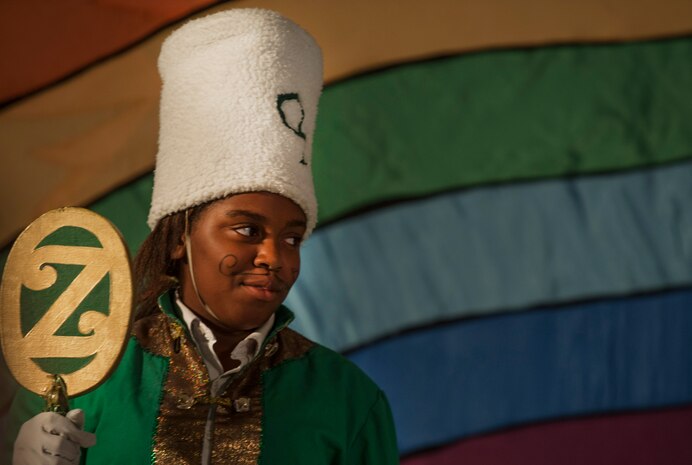 The Green Guard, played by Kyla Jackson, daughter of Michele Jackson, participates in the stage production of “The Wizard of Oz” Aug. 2, 2013, produced by the Missoula Children's Theatre and the Youth Programs Center at Joint Base Charleston- Weapons Station, S.C. The Missoula Children's Theatre International Tour has fostered development life skills in more than a million children. This year alone, the Missoula Children Theatre will work with 65,000 children in more than 1,200 communities in all 50 states and 17 countries. (U.S. Air Force photo/Senior Airman Ashlee Galloway)