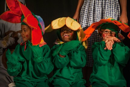 Local children play the 'Fierce and Ferocious Flowers,' in the stage production of “The Wizard of Oz” Aug. 2, 2013, produced by the Missoula Children's Theatre and the Youth Programs Center at Joint Base Charleston- Weapons Station, S.C. The Missoula Children's Theatre International Tour has fostered development life skills in more than a million children. This year alone, the Missoula Children Theatre will work with 65,000 children in more than 1,200 communities in all 50 states and 17 countries. (U.S. Air Force photo/Senior Airman Ashlee Galloway))